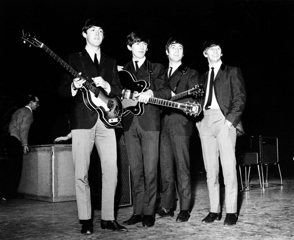 The Beatles stand on stage at the Prince of Wales Theater in London, Nov. 4, 1963, during rehearsals for the royal variety show. From left, Paul McCartney, bass guitarist; George Harrison, guitarist; John Lennon, guitarist; and Ringo Starr, drummer. (AP Photo)