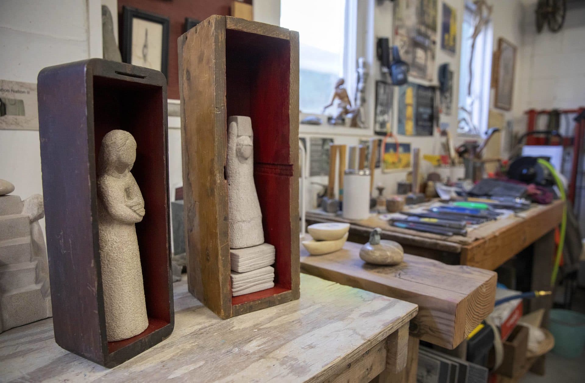 "Melted Heart" (left) by sculptor Nora Valdez in her studio at Humphreys Street Studios in Dorchester, Mass. (Robin Lubbock/WBUR)