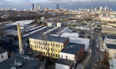 Humphreys Street Studios, with their landmark chimney, in Dorchester, Mass. (Robin Lubbock/WBUR)