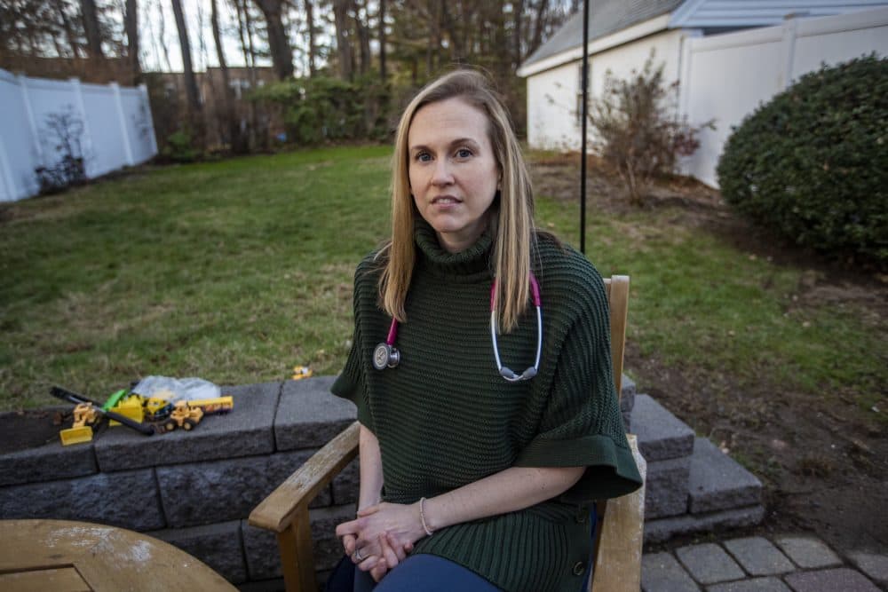 Dr. Michelle Finkle at her home in Milton. She's pregnant, and isn't sure if the COVID-19 vaccine is safe for her or other pregnant people. (Jesse Costa/WBUR)