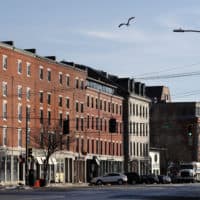 Commercial Street is nearly devoid of pedestrians and traffic on March 25, 2020 in Portland, Maine, just before a stay-at-home order went into place because of the pandemic. (Robert F. Bukaty/AP)