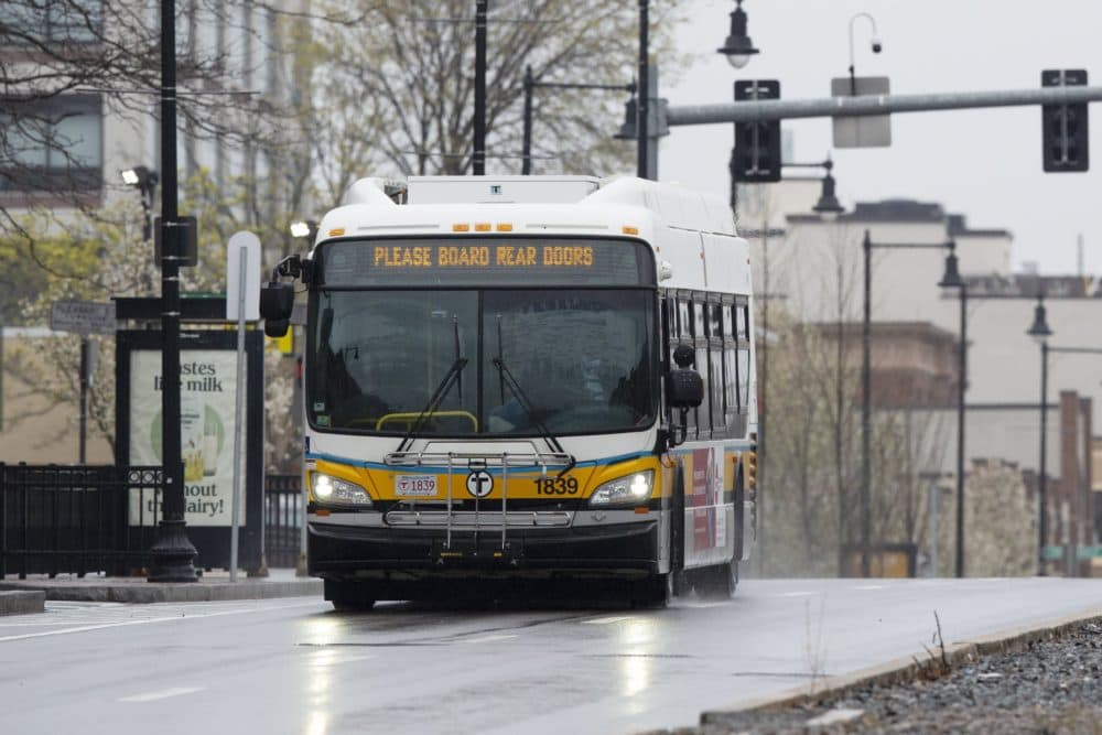 An MBTA bus runs along Commonwealth, Ave., April 24, 2020, in Boston. (Michael Dwyer/AP)