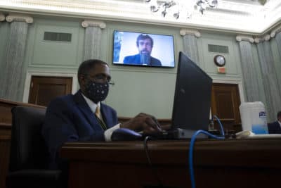 Twitter CEO Jack Dorsey appears on a screen as he speaks remotely during a hearing before the Senate Commerce Committee on Capitol Hill, Wednesday, Oct. 28, 2020, in Washington. The committee summoned the CEOs of Twitter, Facebook and Google to testify during the hearing. (Michael Reynolds/Pool via AP)