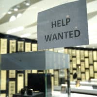 A Help Wanted sign is posted at a Designer Eyes store at Brickell City Centre, Friday, Nov. 6, 2020, in Miami.(Lynne Sladky/AP)