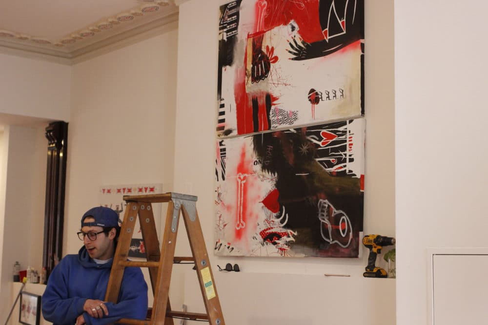 Local artist Sam Fish in his temporary gallery at 254 Newbury Street in March 2020, days before his gallery opening was canceled due to the COVID-19 pandemic. (Jenn Stanley/WBUR)
