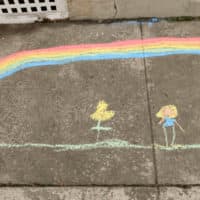 A chalk drawing by Abigail Fichthorn, 8, and her mother Jeanni Fichthorn, outside their home on Penn Ave in Wernersville, Penn. on March 24, 2020. (Ben Hasty/MediaNews Group/Reading Eagle via Getty Images)
