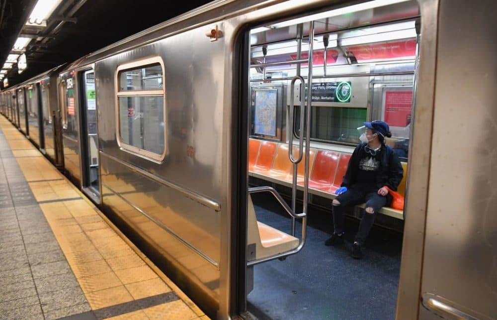 A commuter rides in a MTA subway car during morning rush hour on June 8, 2020, in New York City. (Angela Weiss/AFP/Getty Images)