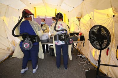 COVID-19 testing is done on Buffum Street by the Lynn Community Health Center in Lynn, MA on Aug. 11, 2020.  (Suzanne Kreiter/The Boston Globe via Getty Images)