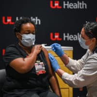 LaShawn Scott, RN receives a COVID-19 vaccination at University of Louisville Hospital on December 14, 2020 in Louisville, Kentucky. The Pfizer-BioNTech vaccine became available for specified use on Monday morning to five members of hospital staff. (Jon Cherry/Getty Images)