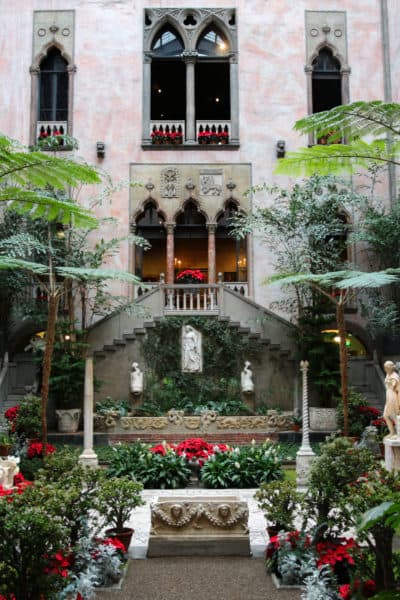 The courtyard of the Gardner Museum prepared for holiday visitors. Now that the museum is closed, the plants are being donated to organizations like the Veronica Robles Cultural Center and the Boston Chinatown Neighborhood Center. (Courtesy Isabella Stewart Gardner Museum)