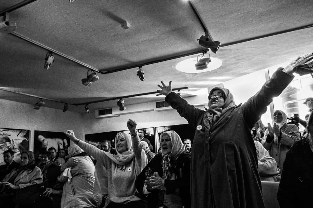 In 2017, Nedžiba Salihović and other Srebrenica widows celebrate the conviction of Bosnian Serb General Ratko Mladić for his role in the 1995 genocide at Srebrenica. Salihović lost her husband and son in the massacre. (Ron Haviv)