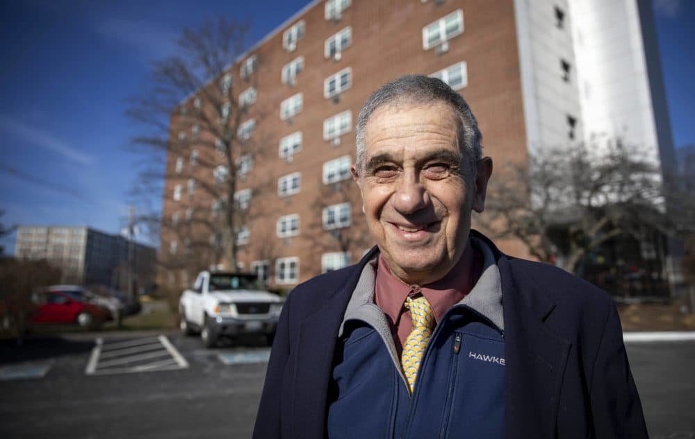 Jerry Halberstadt outside his low-income senior housing building in Peabody. He was masked except for this photo taken at a distance. (Robin Lubbock/WBUR)