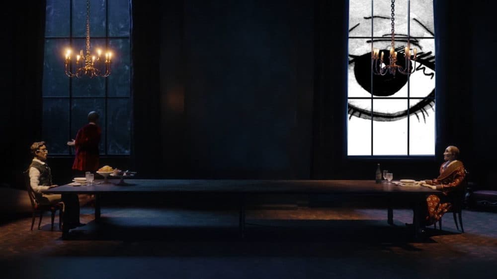 Luna watches Roderick and William have dinner in a still from "The Fall of the House of Usher. (Courtesy operabox.tv/Boston Lyric Opera)