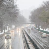 Snow falling on Storrow Drive Monday afternoon as the nor'easter moves into Boston. (Robin Lubbock/WBUR)