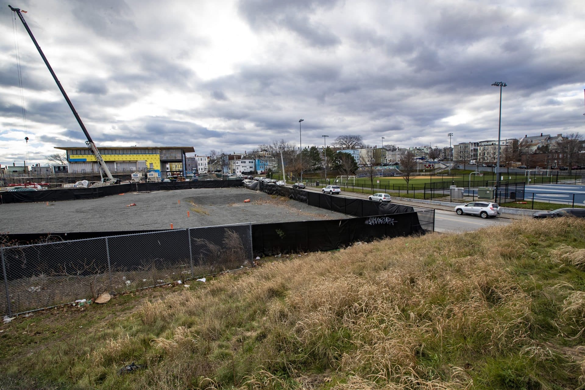 The empty lot where Eversource plans to build a substation in the City Yards, which is across the street from the American Legion Playground and behind the new East Boston Police station being constructed. (Jesse Costa/WBUR)