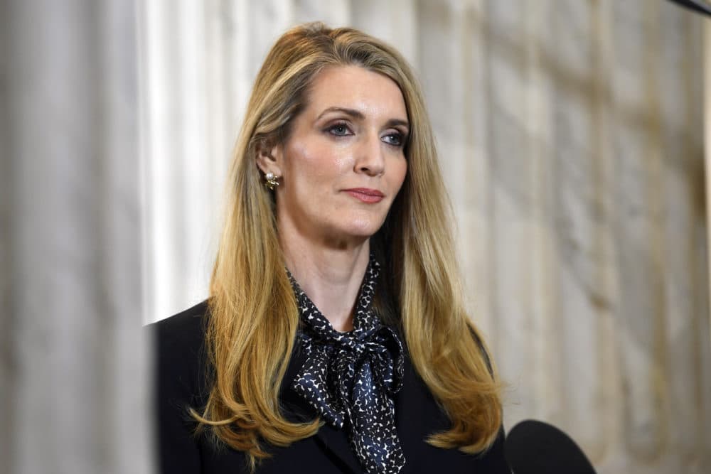 In this Friday, March 20, 2020, file photo, Sen. Kelly Loeffler, R-Georgia, waits to speak in a television interview on Capitol Hill in Washington. WNBA players urged people to vote against Atlanta Dream co-owner Loeffler. Loeffler, who spoke out publicly against the league’s social justice plans and sent a letter to WNBA Commissioner Cathy Engelbert objecting to the initiatives to honor the Black Lives Matter movement once the season began last month, lost to Rev. Raphael Warnock on Jan. 5, 2021. (Susan Walsh/AP)