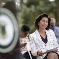 Rhode Island Gov. Gina Raimondo sits during a news conference in Providence. (David Goldman/AP)