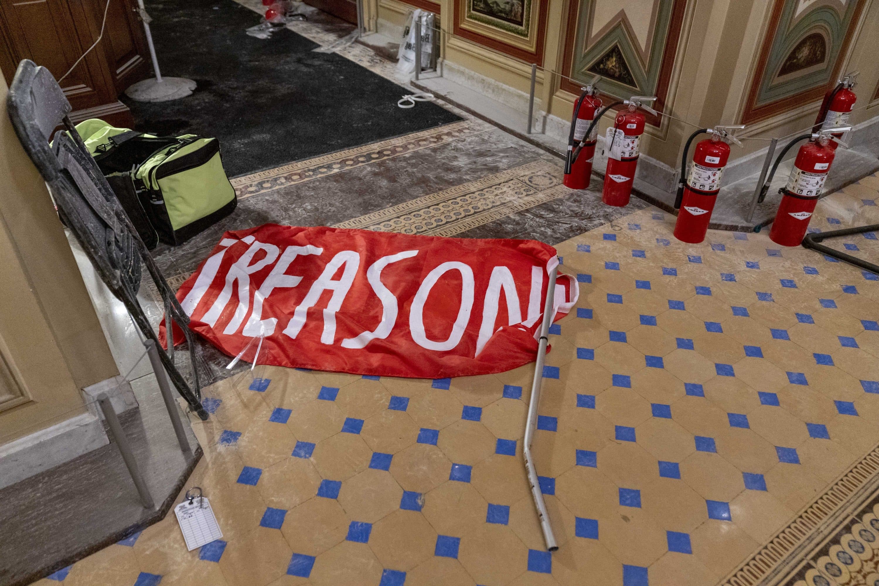 A flag that reads "Treason" is visible on the ground in the early morning hours of Thursday, Jan. 7, 2021, a day after protesters stormed the Capitol in Washington. (Andrew Harnik/AP)