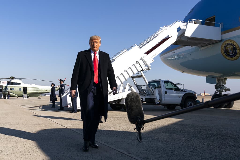 President Donald Trump walks to speak with reporters before boarding Air Force One upon departure, Tuesday, Jan. 12, at Andrews Air Force Base. (AP Photo/Alex Brandon)