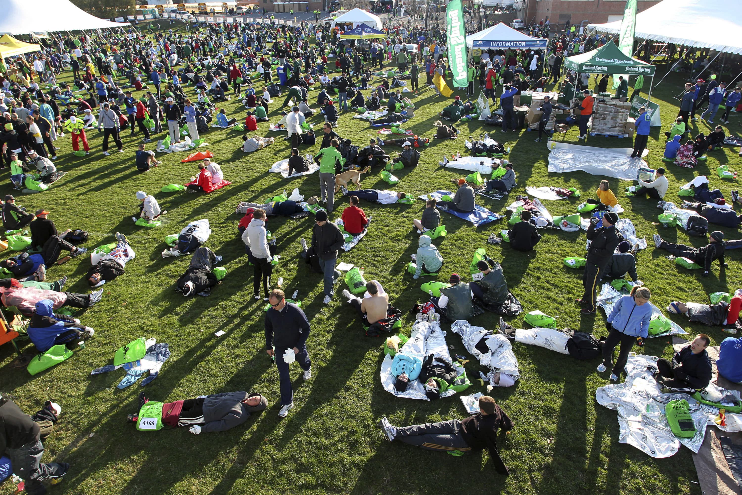 In this April 18, 2011 photo, runners gather at the athletes village prior to the 115th running of the Boston Marathon in Hopkinton, Mass. Organizers of the marathon, postponed indefinitely because of the coronavirus pandemic, have launched a virtual Athletes' Village in 2020 to reproduce at least some of the camaraderie of the real thing. (Stew Milne/AP)