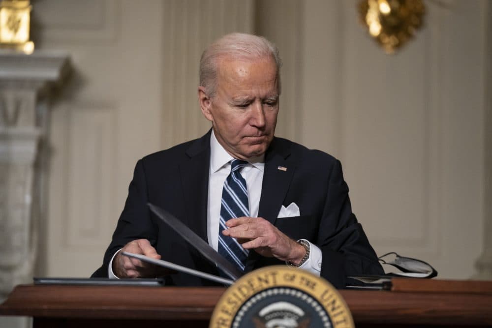 President Biden signed a series of executive orders on climate change, in the State Dining Room of the White House, on Jan. 27. (Evan Vucci/AP)