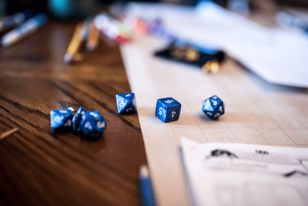 Dice, pencils and gameplay for Dungeons & Dragons. (Danielle Donders/Getty Images)