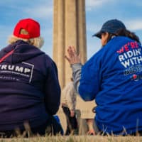 A President Donald Trump and a former Vice President Joe Biden supporter converse before the Joe Biden Campaign Rally at the National World War I Museum and Memorial on March 7, 2020 in Kansas City, Missouri. (Kyle Rivas/Getty Images)