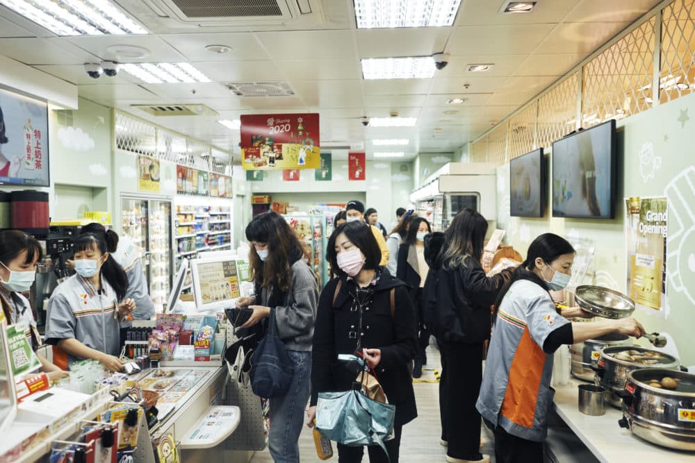 Customers wear face masks inside a store on Dec. 2, 2020, in Taipei, Taiwan. Taiwan imposed mandatory mask-wearing regulations in some circumstances, including on transport services and in markets and restaurants, as it tries to keep its record of controlling COVID-19 infections in check. (An Rong Xu/Getty Images)