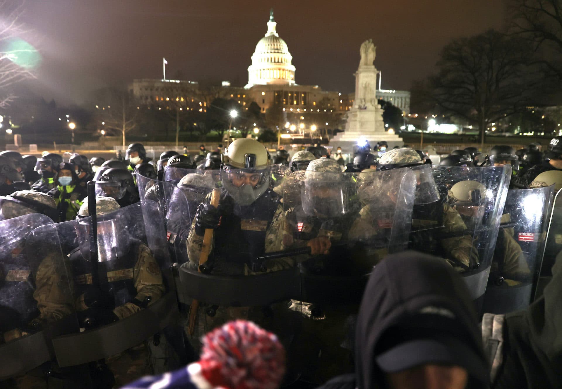 Members of the National Guard assist police officers in dispersing protesters who are gathering at the U.S. Capitol Building.(Tasos Katopodis/Getty Images)