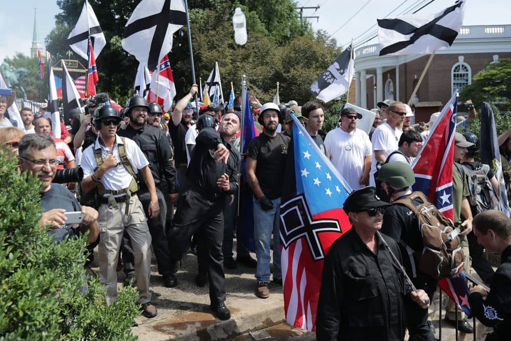 Hundreds of white nationalists, neo-Nazis, KKK and members of the "alt-right" hurl water bottles back and forth against counter demonstrators on the outskirts of Emancipation Park during the Unite the Right rally Aug. 12, 2017 in Charlottesville, Virginia. (Chip Somodevilla/Getty Images)
