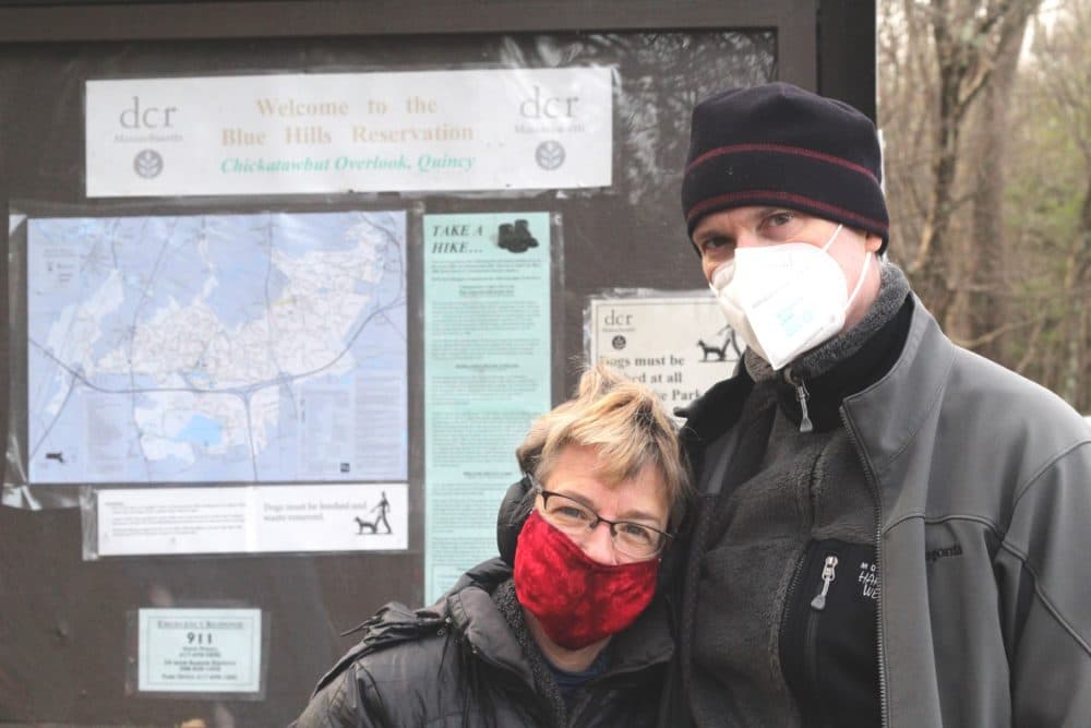 Married couple Melissa McGrew (left) and Andrew Untch (right) haven't missed the tradition of hiking on New Year's Day since they've been together. (Quincy Walters/WBUR)