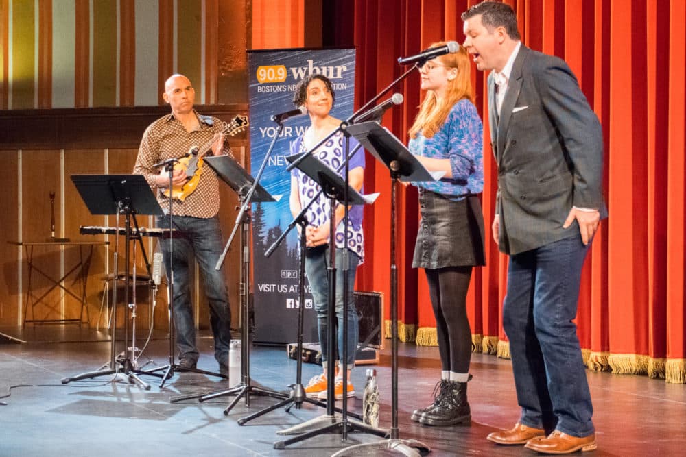 Composer Eric Shimelonis playing the mandolin at WBUR’s ‘Mega Awesome Super Huge Wicked Fun Podcast Playdate’ at Coolidge Corner Theater in 2018. (courtesy of WBUR)