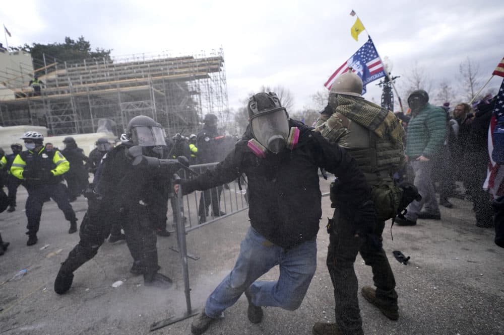 Trump supporters try to break through a police barrier during protests at the U.S. Capitol today, prompting U.S. Capitol Police to take further security measures. (Julio Cortez/AP)