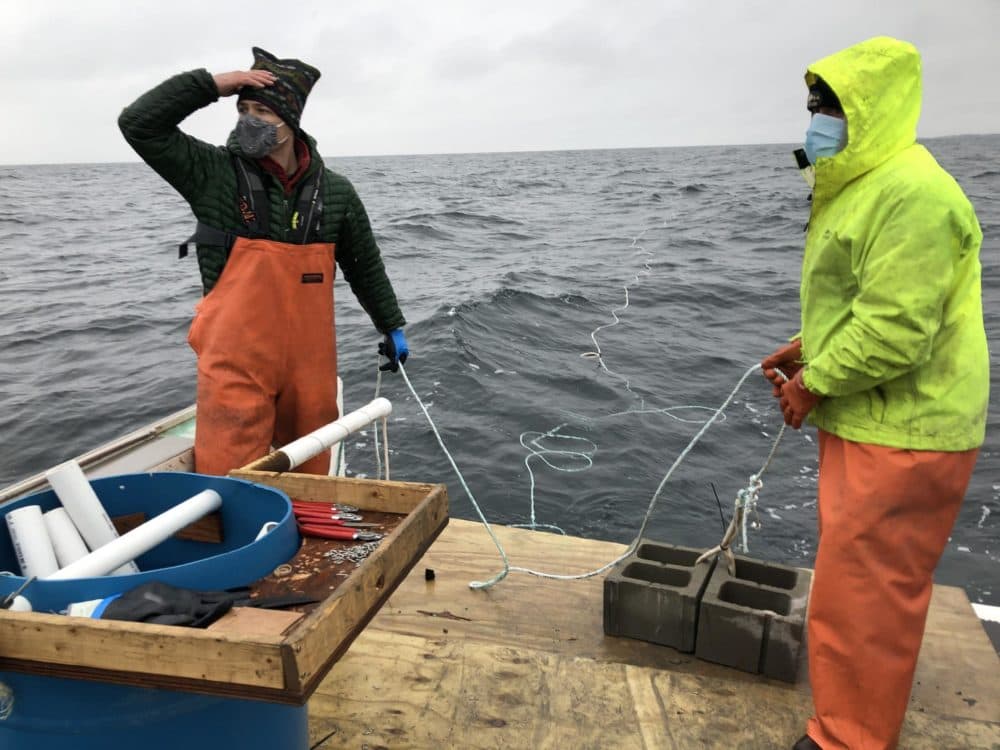 Adam Baske (left) and Capt. Rob Odlin. (Fred Bever/Maine Public)
