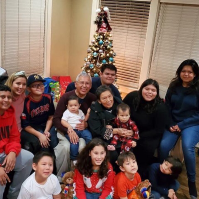 Leticia "Nina" Gloria and her husband Paul Gloria surrounded by their 12 grandchildren. (Courtesy)
