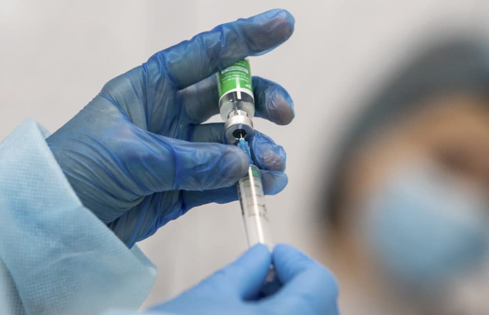 A medic prepares to administer a dose of an AstraZeneca COVID-19 vaccine. (Kyiv's City Hall Press Office via AP)