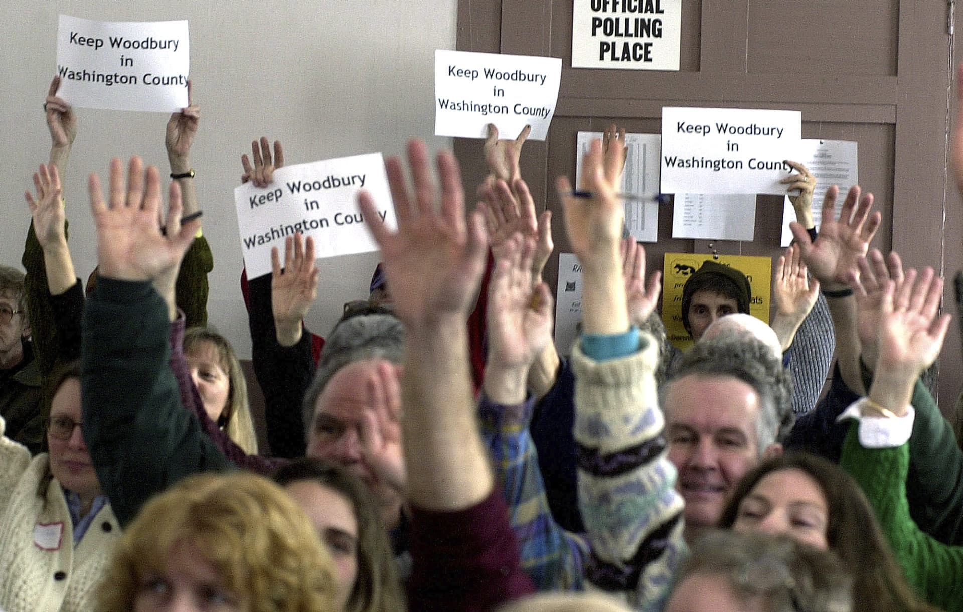 In this March 5, 2002 file photo, citizens vote to support a redistribution resolution at the town's annual meeting in Woodbury, Vt. (Toby Talbot / AP File)