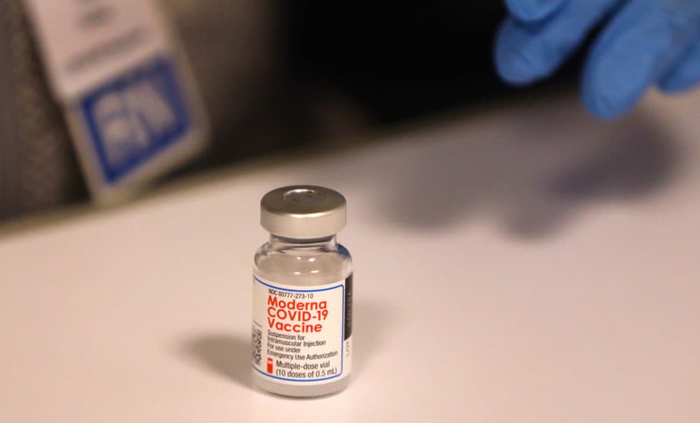 A nurse at Lawrence General Hospital pre-draws doses of the COVID-19 vaccine in Lawrence on Jan. 11. (Pat Greenhouse/The Boston Globe via Getty Images)