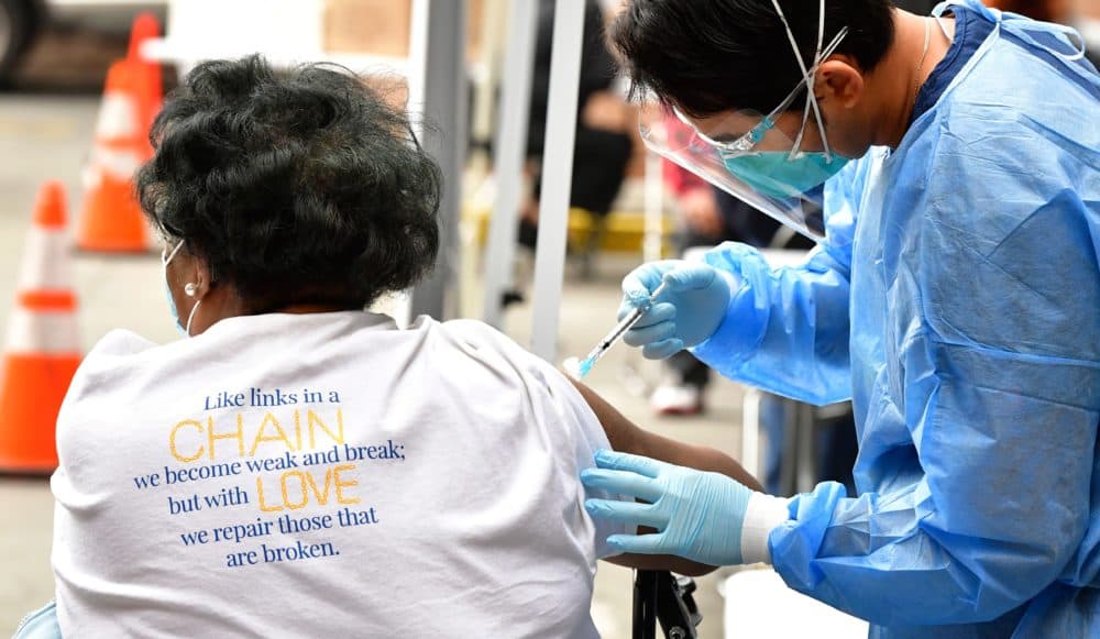 A nurse administers the Moderna COVID-19 vaccine during a distribution of vaccines to seniors above the age of 65 who are experiencing homelessness at the Los Angeles Mission, in the Skid Row area of Downtown Los Angeles on Feb. 10. (Frederic J. Brown/AFP via Getty Images)