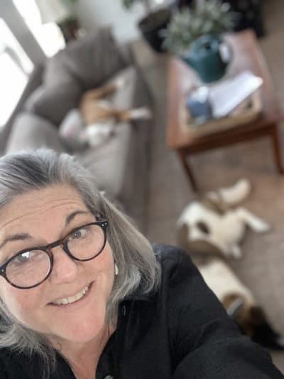 The author, with her puppy, in her barn office. (Courtesy)