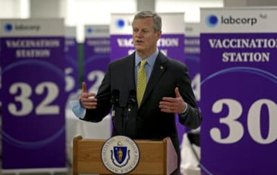 Massachusetts Gov. Charlie Baker speaks at a mega vaccination site for coronavirus at the Natick Mall on Feb. 24. (Matt Stone/The Boston Herald, pool via AP)