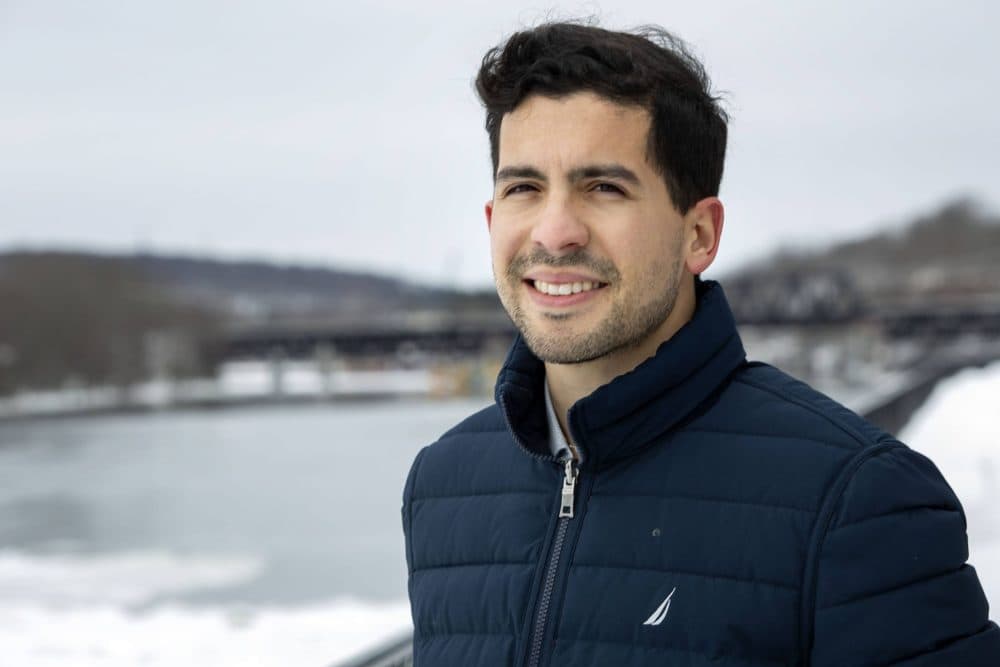 State Rep. Andy Vargas next to the Merrimack River in Haverhill. (Robin Lubbock/WBUR)