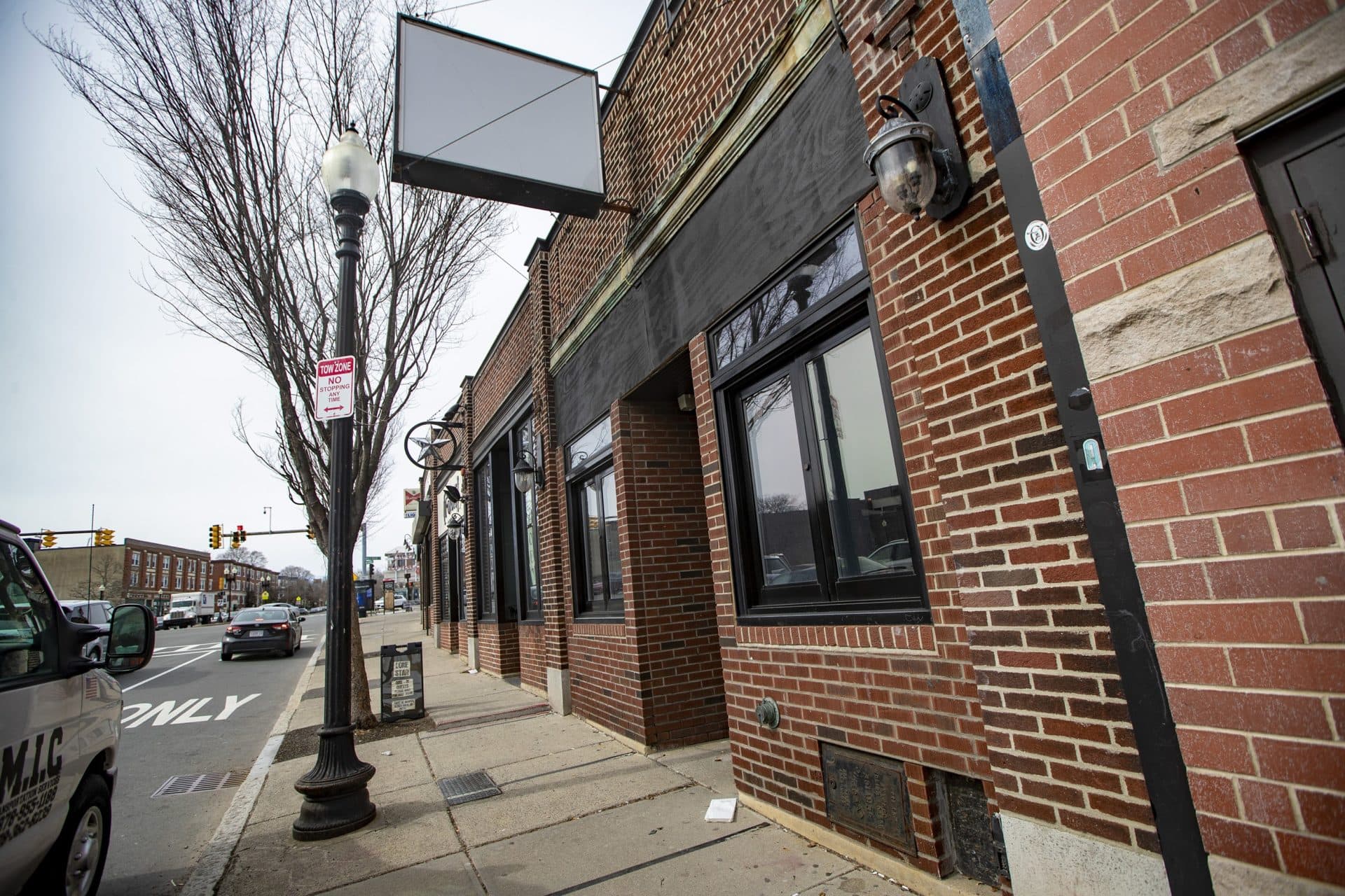 An empty sign where the words Deep Ellum once were written. The restaurant and bar has closed for good. (Jesse Costa/WBUR)
