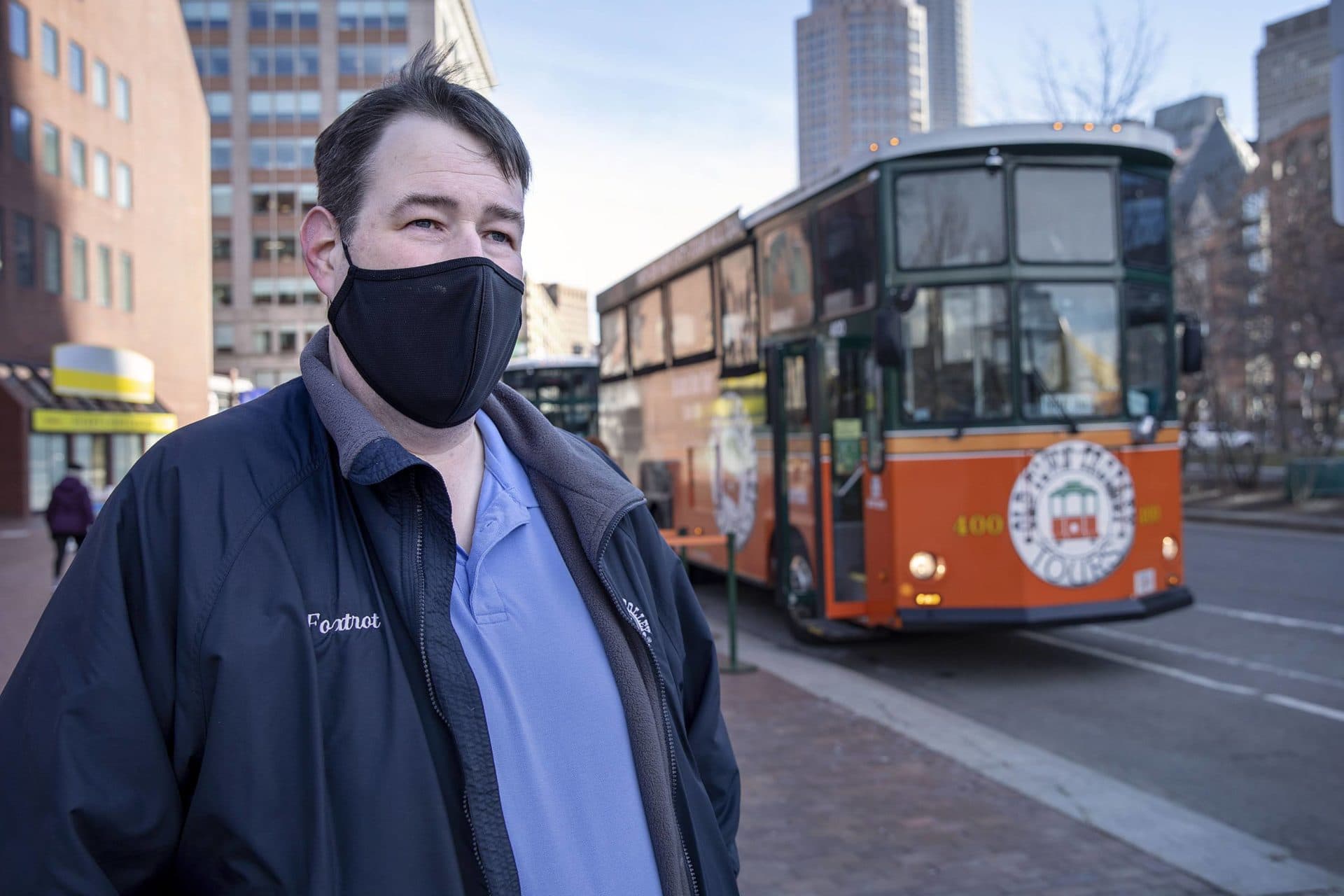 Old Town Trolley Tours driver Micheal Long and his street car on Atlantic Avenue. (Robin Lubbock/WBUR)