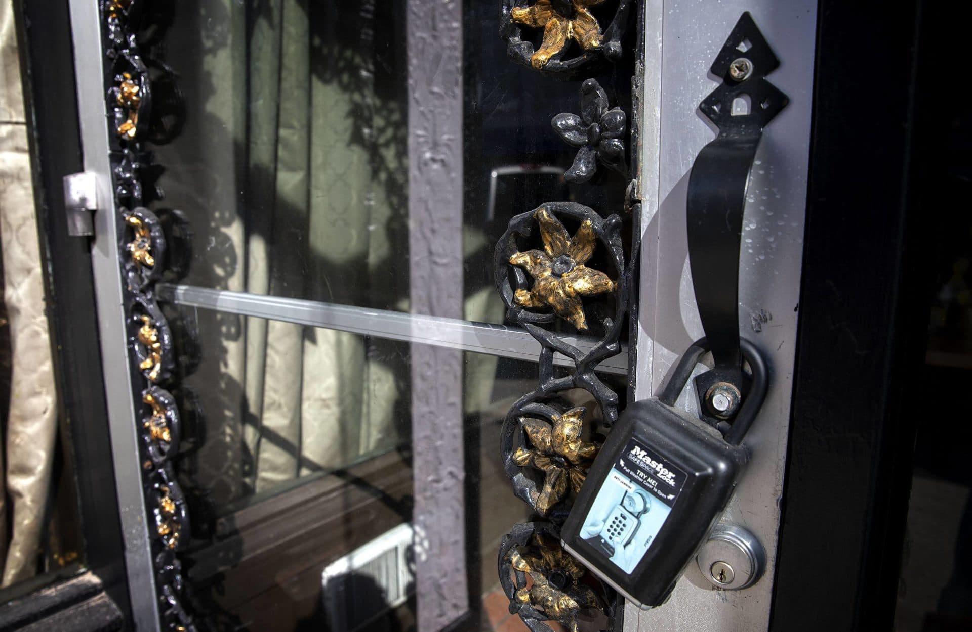 Detailed ironwork on the door of Cuchi Cuchi, an eatery on Main Street, Cambridge, which closed due to the pandemic in May 2020. (Robin Lubbock/WBUR)