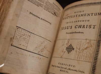 The John Elliot Bible, from 1661, inscribed with language of the native American Mashpee Wampanoag Tribe, who inhabited the area where the Mayflower pilgrims landed in 1620, at the Box Museum in Plymouth south west England, Monday, Sept. 14, 2020. (Alastair Grant/AP Photo)