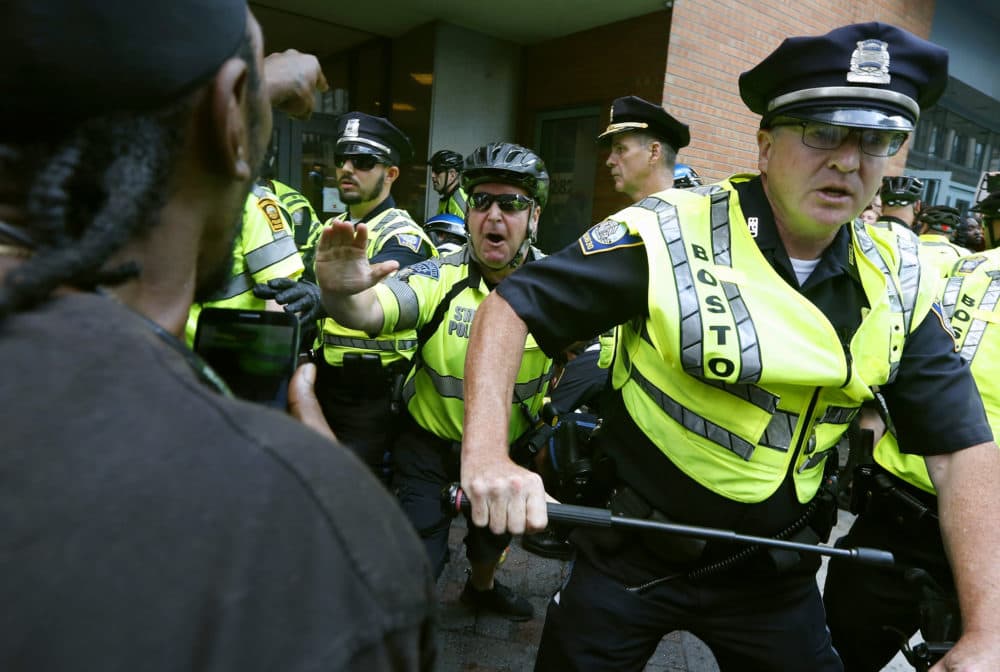 In this Aug. 19, 2017, file photo, counterprotesters clash with police following a "Free Speech" rally staged by conservative activists in Boston. (Michael Dwyer/AP File)