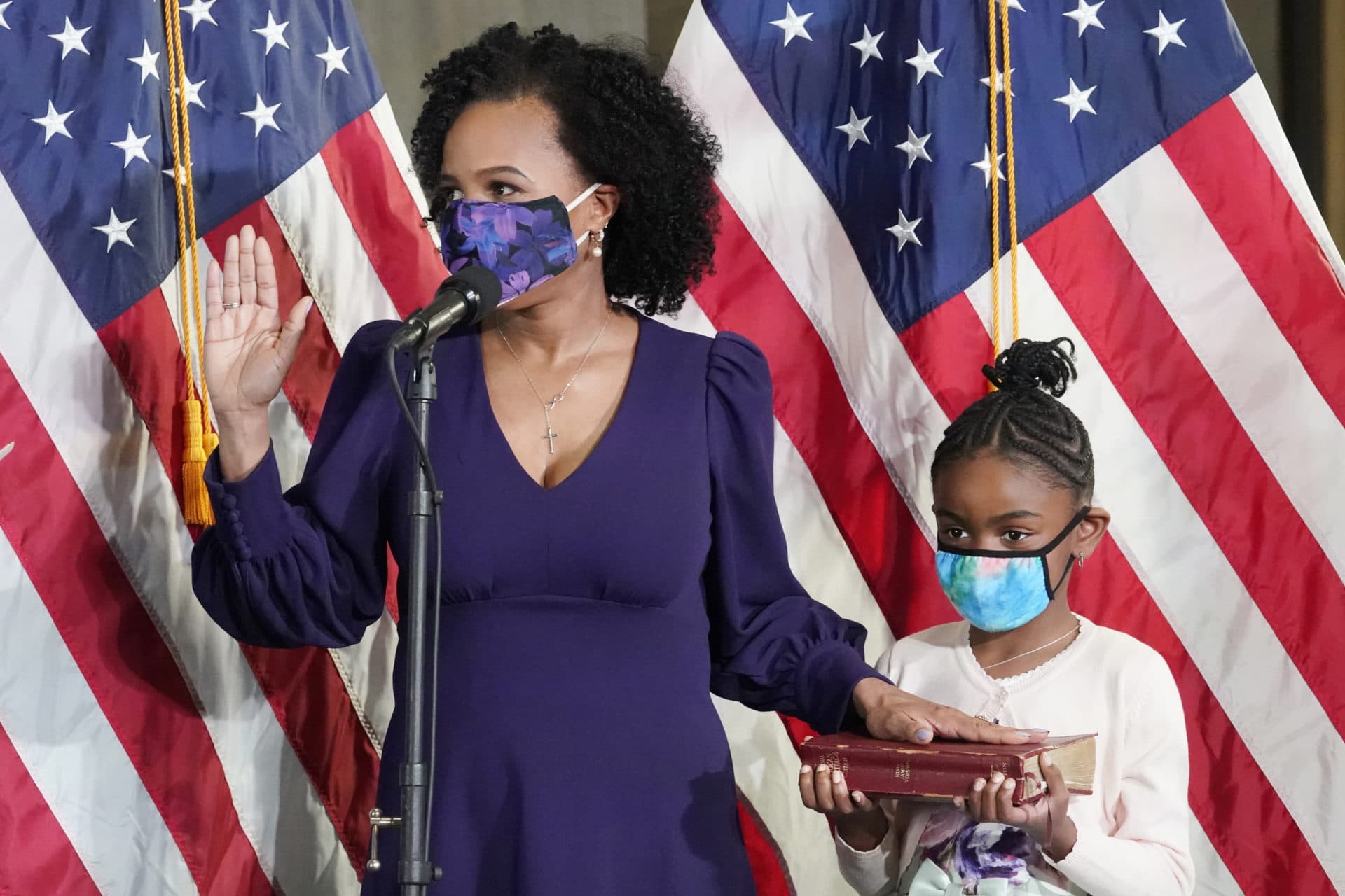 Janey is sworn in as Boston's new mayor while her granddaughter, Rosie, holds a Bible. (Elise Amendola/AP)