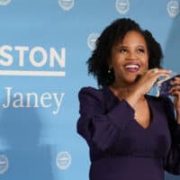 Former Boston City Council President Kim Janey, 55, takes off her face mask to speak after she was sworn in as Boston's new mayor at City Hall, Wednesday, March 24, 2021, in Boston. Janey, who is the city's first female and first person of color to take the office, replaces Marty Walsh who resigned Monday evening to become President Joe Biden's labor secretary. (AP Photo/Elise Amendola)