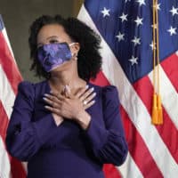 Former Boston City Council President Kim Janey, 55, reacts as she is introduced to be sworn in as Boston's new mayor at City Hall, Wednesday, March 24, 2021, in Boston. Janey, who is the city's first female and first person of color to take the office, replaces Marty Walsh who resigned Monday evening to become President Joe Biden's labor secretary. (AP Photo/Elise Amendola)
